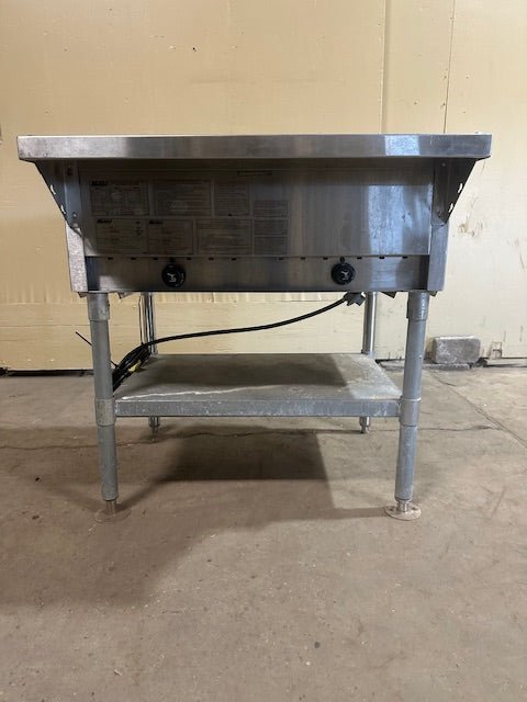 EAGLE GROUP 2 WELL STATIONARY GAS/PROPANE HOT FOOD TABLE WITH GALVANIZED SHELF AND ADJUSTABLE LEGS - Bargains R Ours - #collection_name#