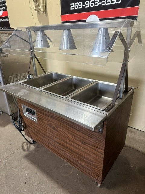 VOLLRATH 3 WELLS HOT FOOD BUFFET TABLE WITH LIGHTED SNEEZE GUARD ON CASTERS - Bargains R Ours - #collection_name#